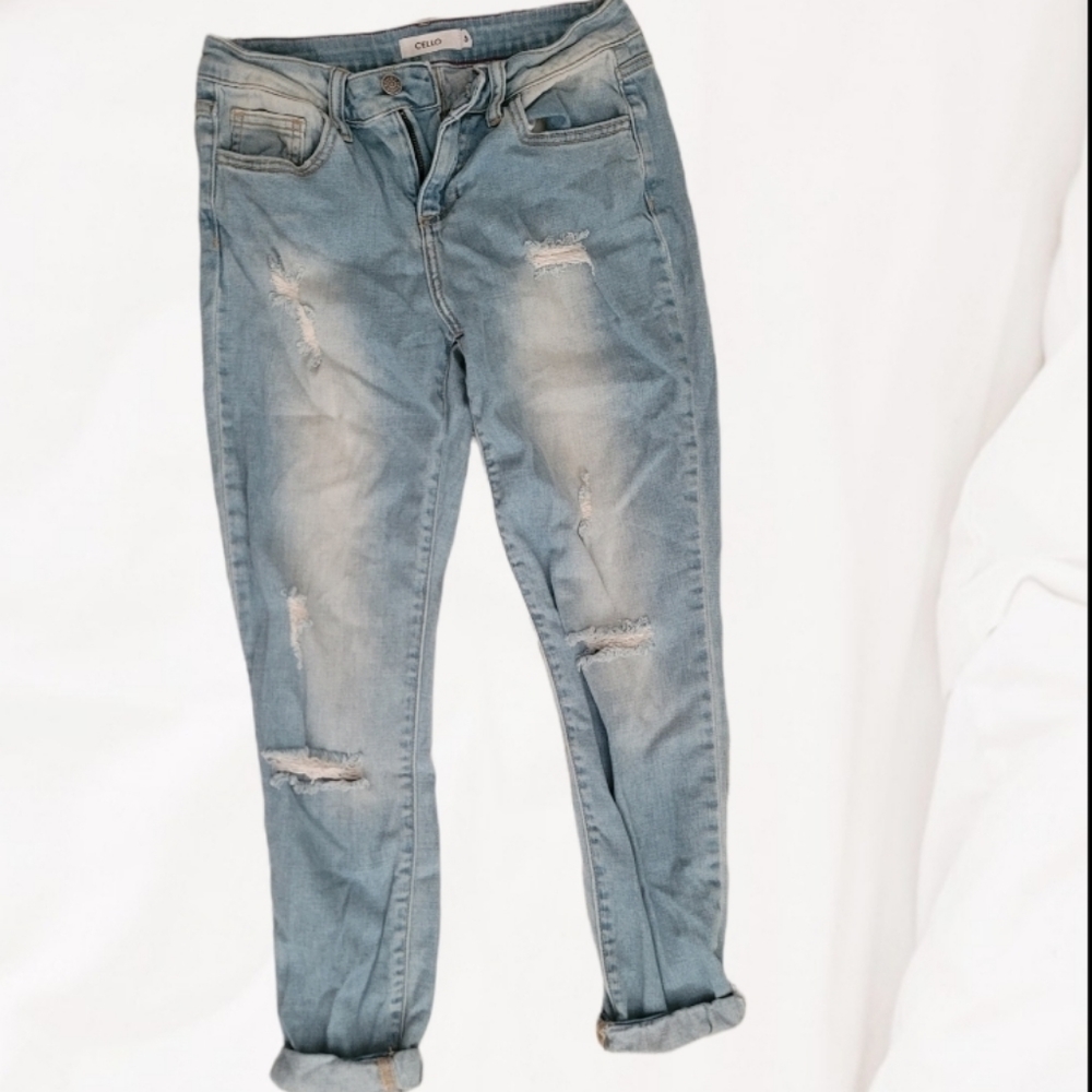 Distressed light blue jean